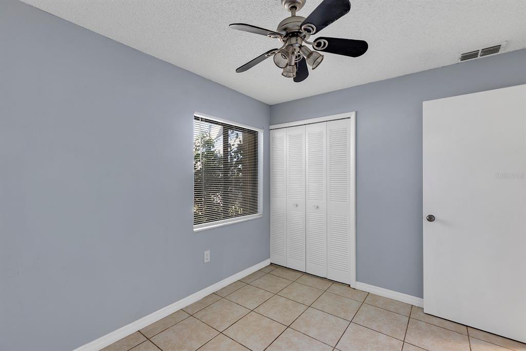 3701 Spring Land Drive Orlando, FL 32818 - Photo 9 of 21 a view of an empty room and window