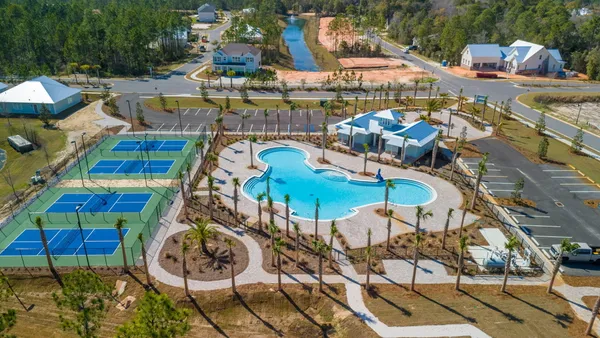 a view of swimming pool with outdoor seating