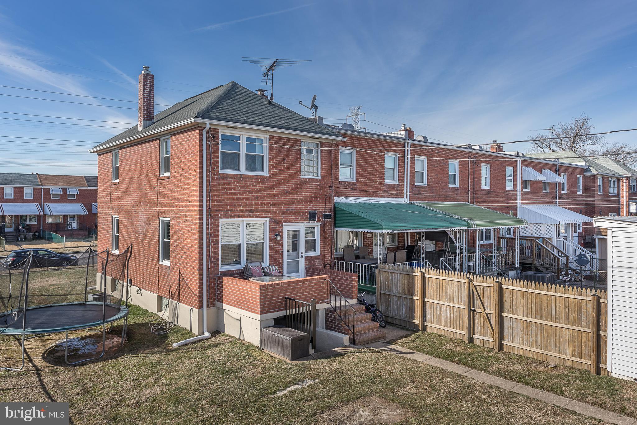 2865 Plainfield Road Baltimore, MD 21222 - Photo 3 of 31 a front view of a house with a porch