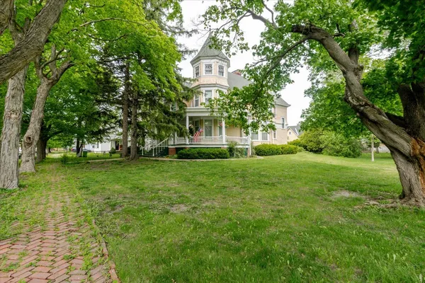 a front view of a house with a yard