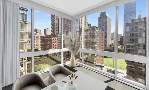 a view of a living room and a balcony