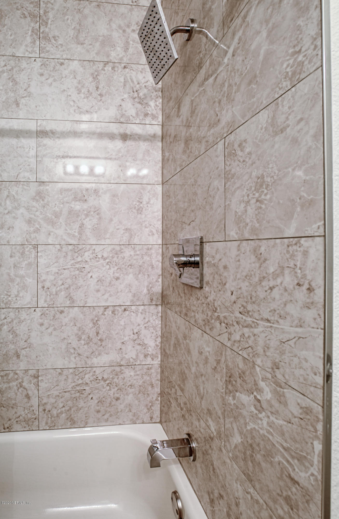 3104 Rogero Road Jacksonville, FL 32277 - Photo 30 of 38 a bathroom with a bathtub