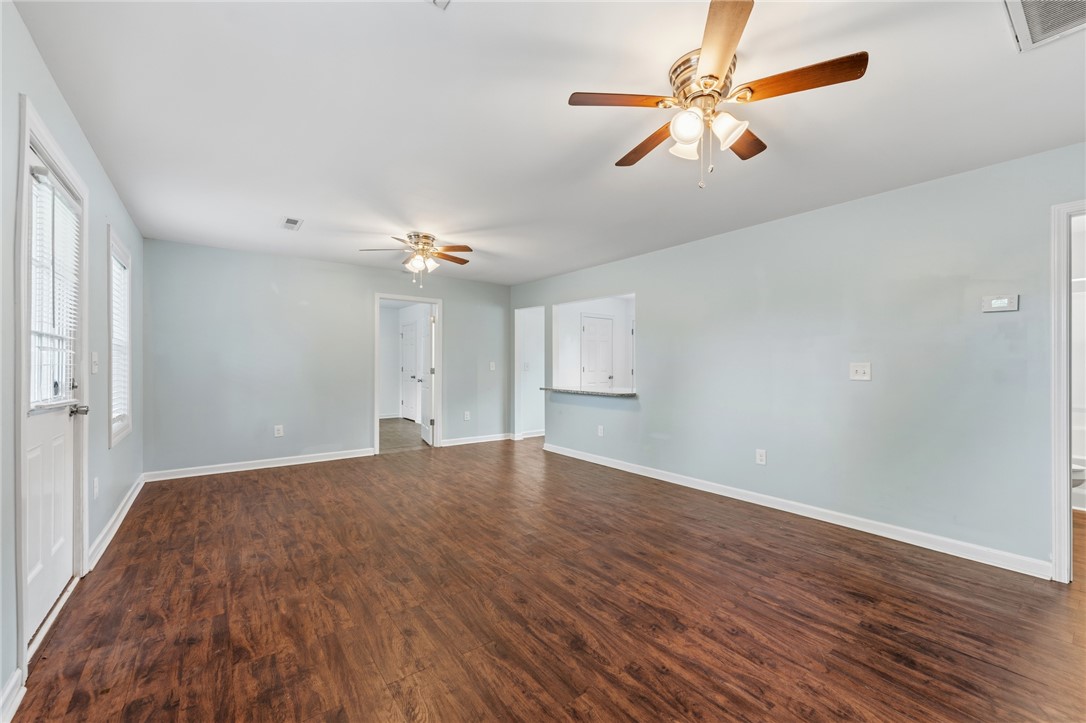 104 Leah Drive Pendleton, SC 29670 - Photo 6 of 23 This airy living space features lustrous hardwood floors and a convenient pass-through to the kitchen.