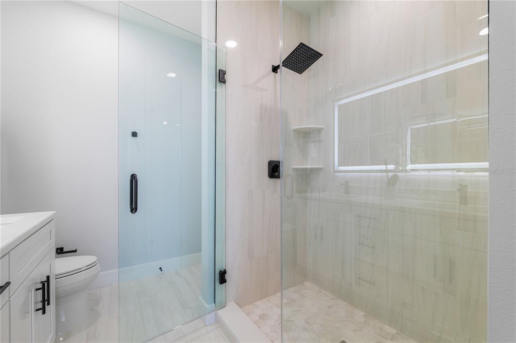 2608 West St Joseph Street, Unit 2 Tampa, FL 33607 - Photo 13 of 29 a bathroom with a shower and a toilet