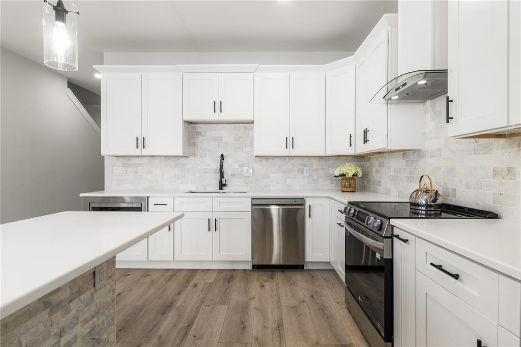 2608 West St Joseph Street, Unit 2 Tampa, FL 33607 - Photo 14 of 29 a kitchen with granite countertop white cabinets and white appliances