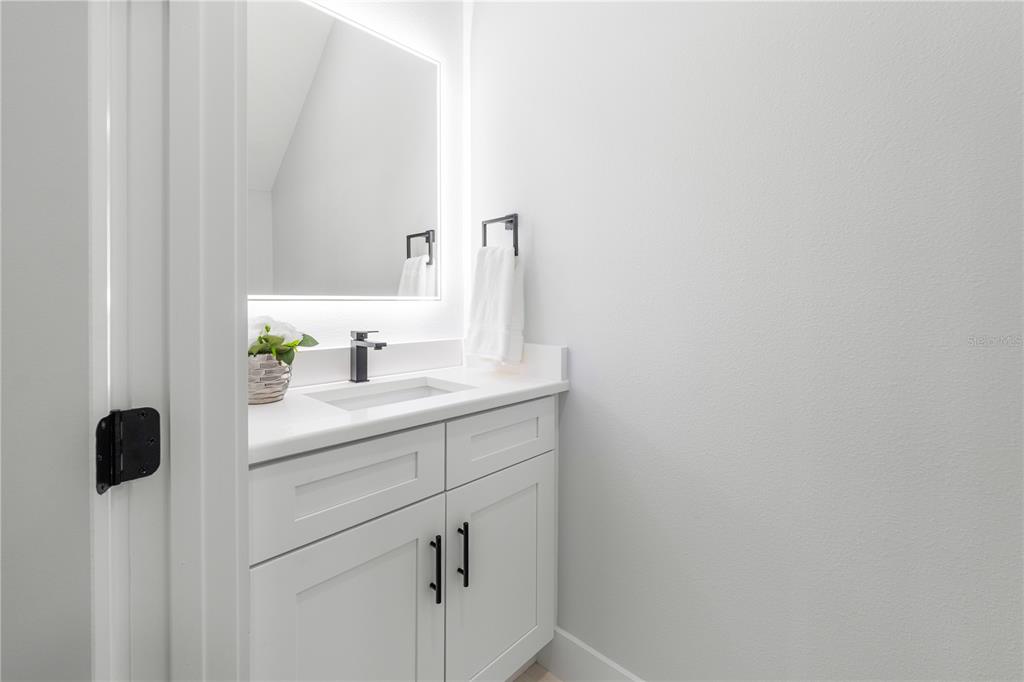 2608 West St Joseph Street, Unit 2 Tampa, FL 33607 - Photo 18 of 29 a bathroom with a sink and a mirror