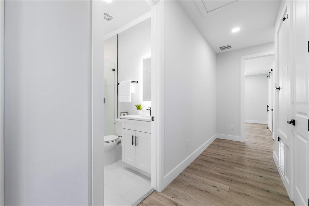 2608 West St Joseph Street, Unit 2 Tampa, FL 33607 - Photo 23 of 29 a bathroom with a sink and mirror with toilet