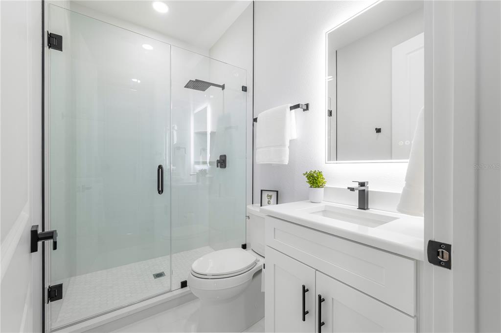 2608 West St Joseph Street, Unit 2 Tampa, FL 33607 - Photo 24 of 29 a bathroom with a sink a toilet and shower