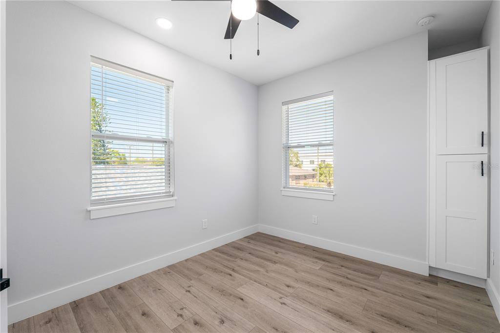 2608 West St Joseph Street, Unit 2 Tampa, FL 33607 - Photo 26 of 29 a view of an empty room with wooden floor and a window
