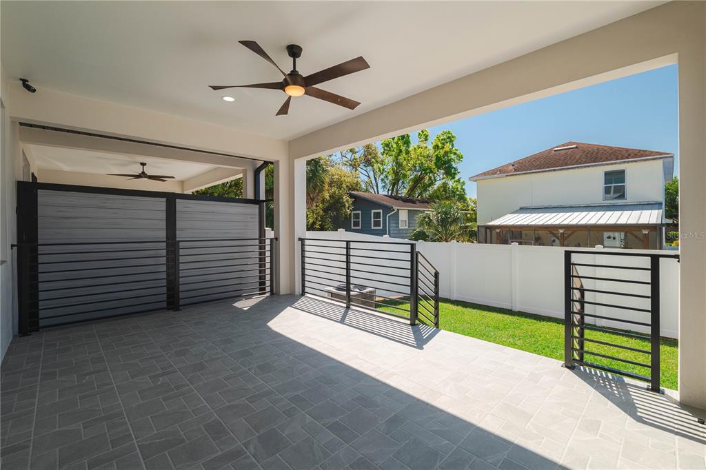2608 West St Joseph Street, Unit 2 Tampa, FL 33607 - Photo 5 of 29 a porch with a bench