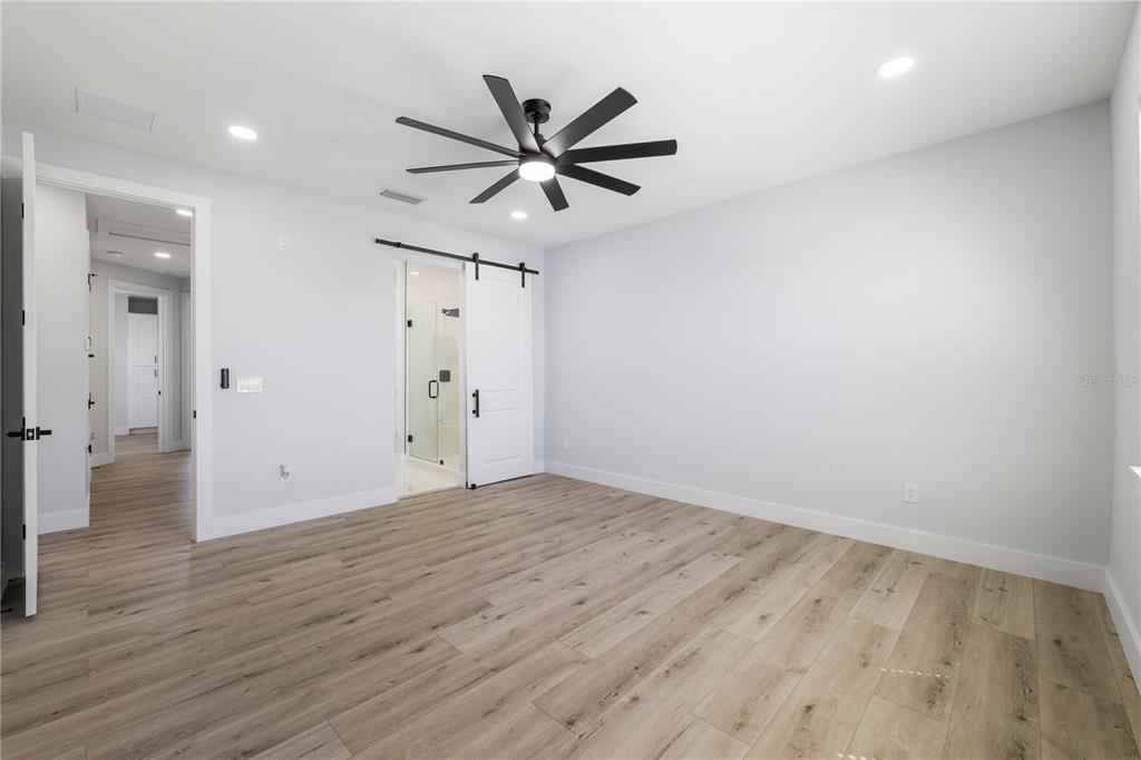 2608 West St Joseph Street, Unit 2 Tampa, FL 33607 - Photo 10 of 29 wooden floor in an empty room