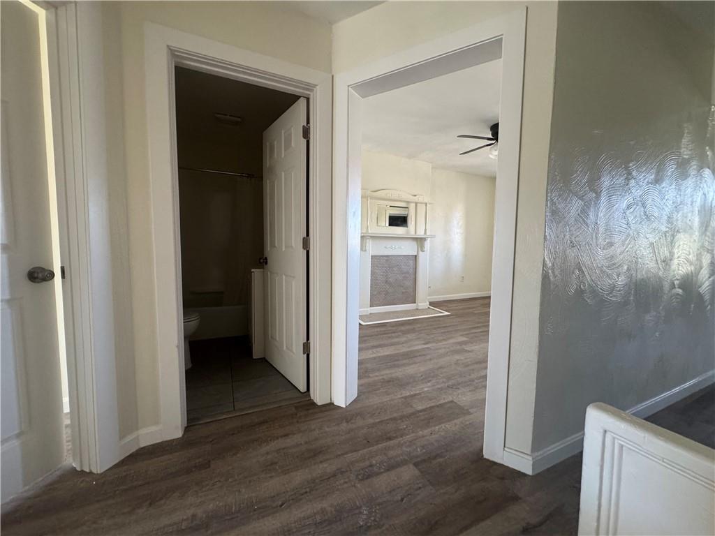 5423 Wellesley Avenue Pittsburgh, PA 15206 - Photo 14 of 27 a view of a hallway with wooden floor