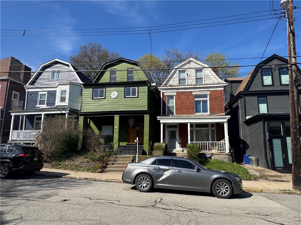 5423 Wellesley Avenue Pittsburgh, PA 15206 - Photo 2 of 27 a car parked in front of a house