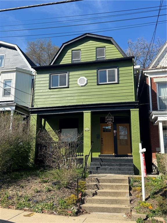 5423 Wellesley Avenue Pittsburgh, PA 15206 - Photo 3 of 27 a front view of a house with garden