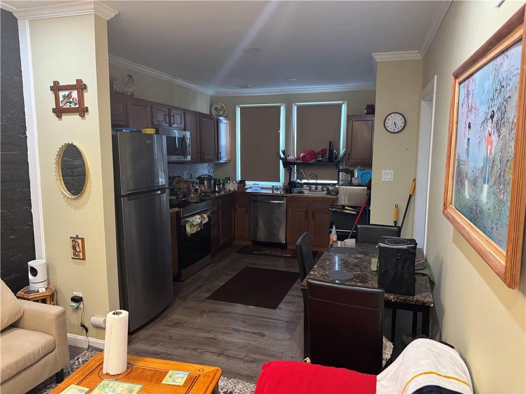 5423 Wellesley Avenue Pittsburgh, PA 15206 - Photo 5 of 27 a kitchen with stainless steel appliances granite countertop a refrigerator stove and sink