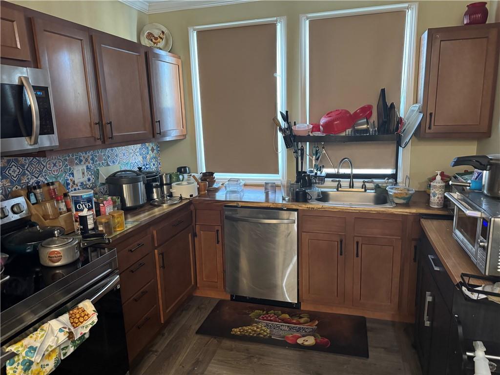 5423 Wellesley Avenue Pittsburgh, PA 15206 - Photo 6 of 27 a kitchen with stainless steel appliances granite countertop a sink stove and cabinets