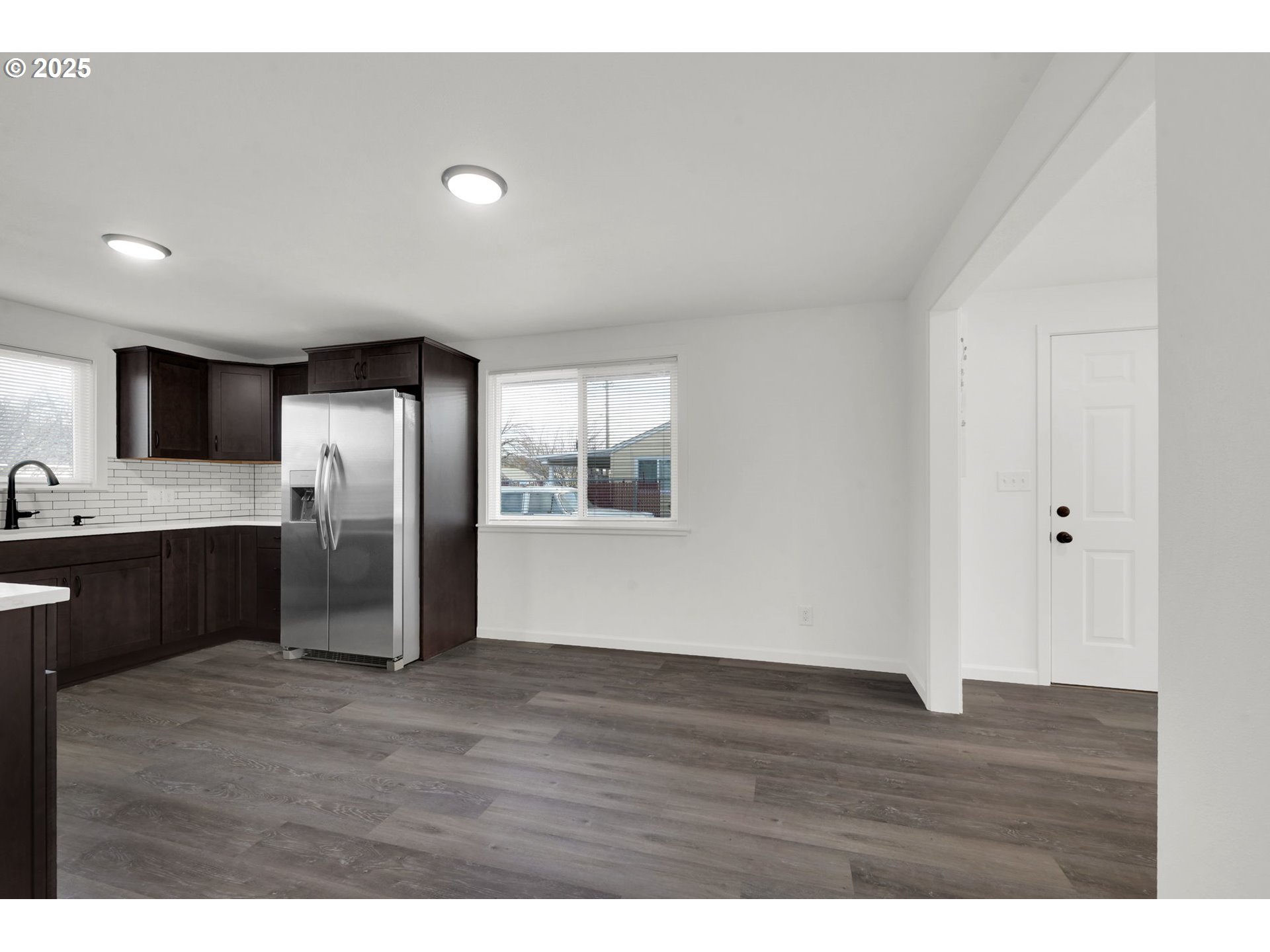 1899 Scott Road Springfield, OR 97477 - Photo 8 of 36 a view of kitchen with stainless steel appliances granite countertop a refrigerator a sink dishwasher with wooden floor