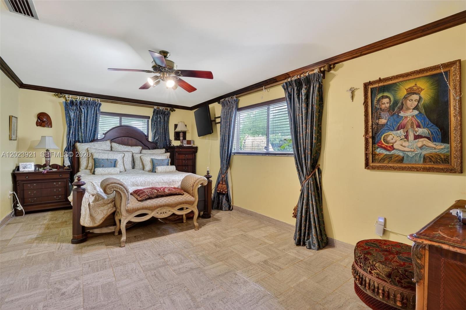 8461 Southwest 68th St Road Miami, FL 33143 - Photo 61 of 65 a bedroom with a bed couch and a window