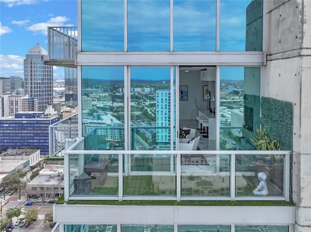 a room with gym equipment and large windows