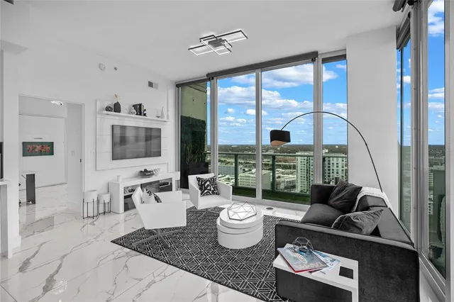 a living room with furniture and a large window