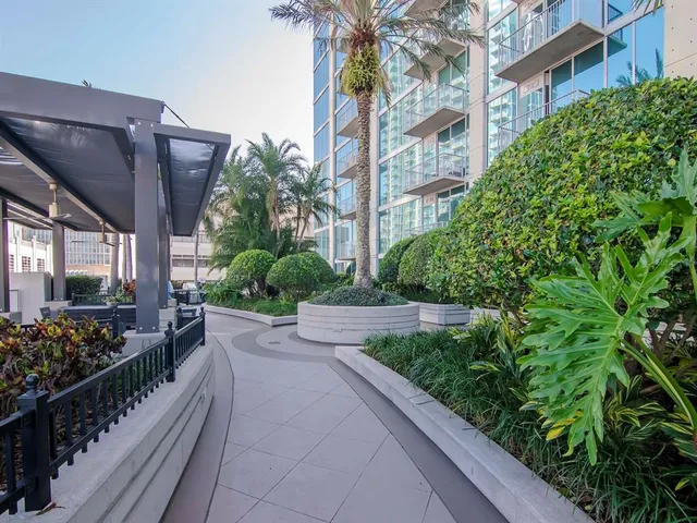 a lobby with furniture and a large window