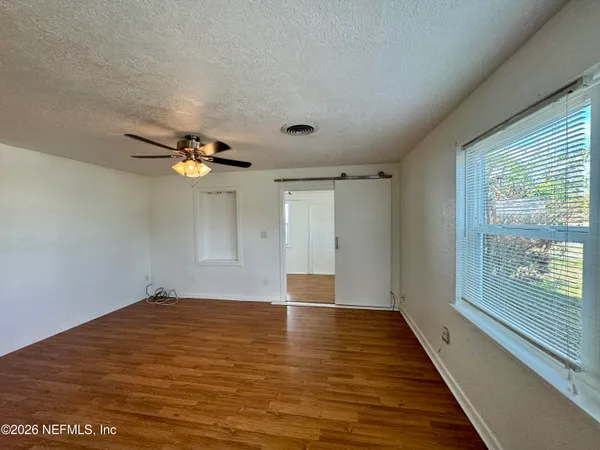 a view of an empty room with a window