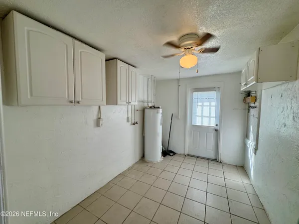 a view of a storage & utility room with a window