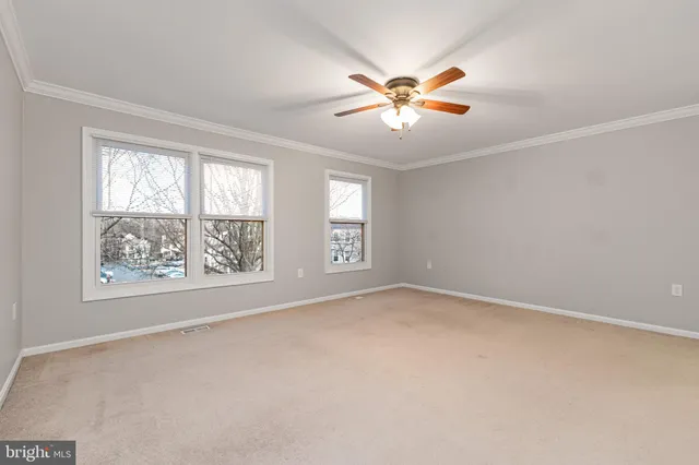 a bathroom with a toilet a sink and a mirror
