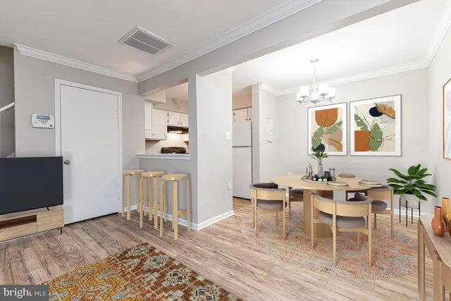 a view of a livingroom with furniture and wooden floor