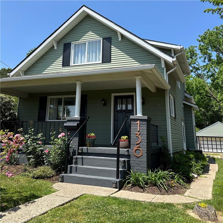 136 Morgan Street Lower Burrell, PA 15068 - Photo 1 of 32 a front view of a house with garden