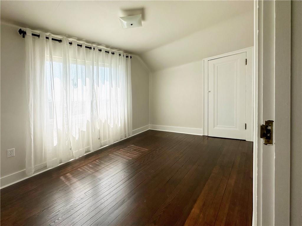 136 Morgan Street Lower Burrell, PA 15068 - Photo 12 of 32 an empty room with wooden floor and windows