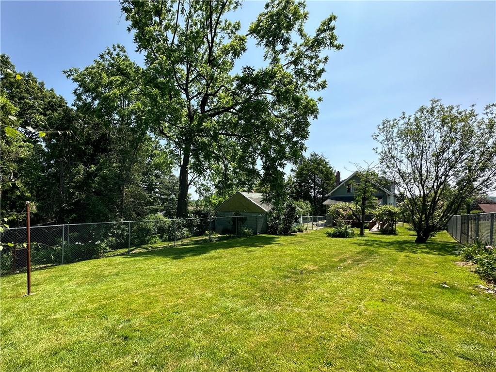 136 Morgan Street Lower Burrell, PA 15068 - Photo 24 of 32 a view of a yard with grass and trees