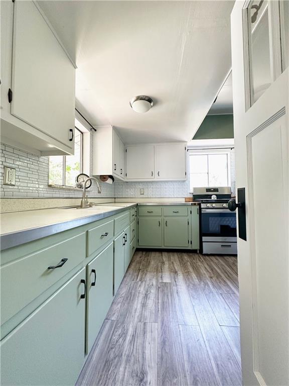 136 Morgan Street Lower Burrell, PA 15068 - Photo 3 of 32 a kitchen with stainless steel appliances cabinets a sink and a large window