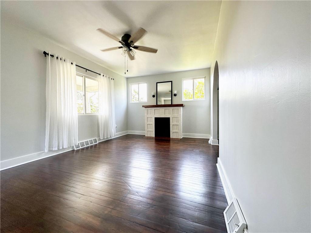 136 Morgan Street Lower Burrell, PA 15068 - Photo 4 of 32 a view of a livingroom with wooden floor and a ceiling fan