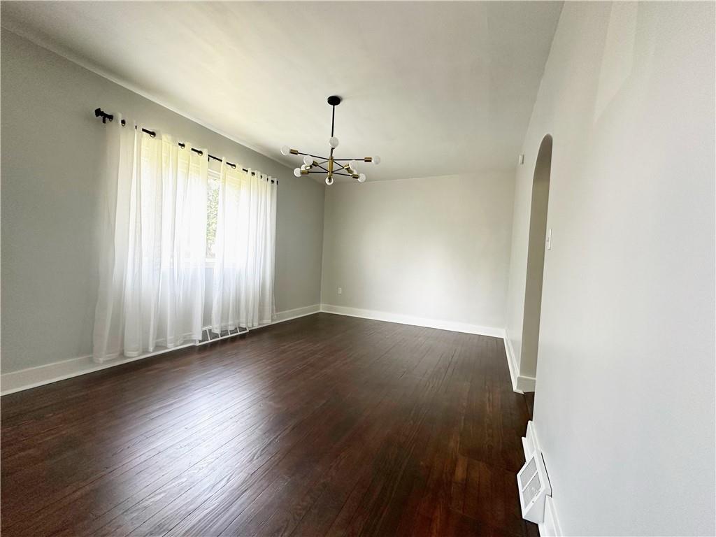 136 Morgan Street Lower Burrell, PA 15068 - Photo 7 of 32 an empty room with wooden floor and windows