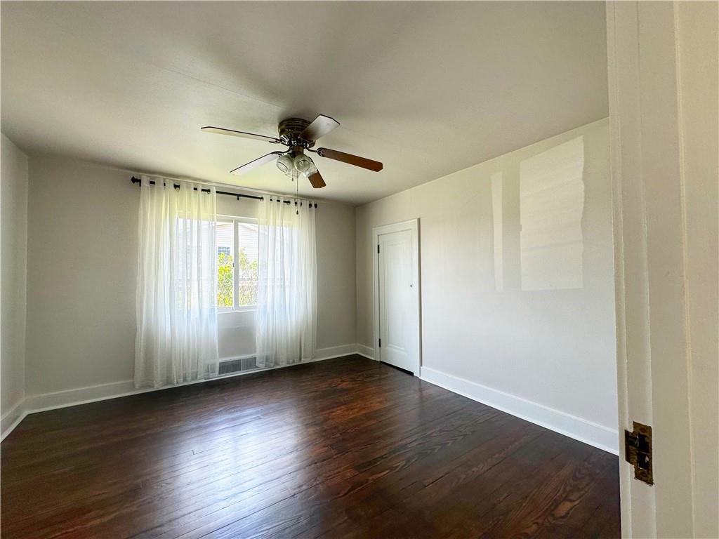 136 Morgan Street Lower Burrell, PA 15068 - Photo 9 of 32 an empty room with wooden floor and windows