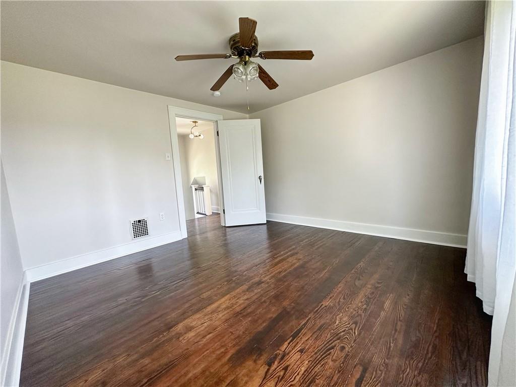 136 Morgan Street Lower Burrell, PA 15068 - Photo 10 of 32 a view of empty room with wooden floor and fan