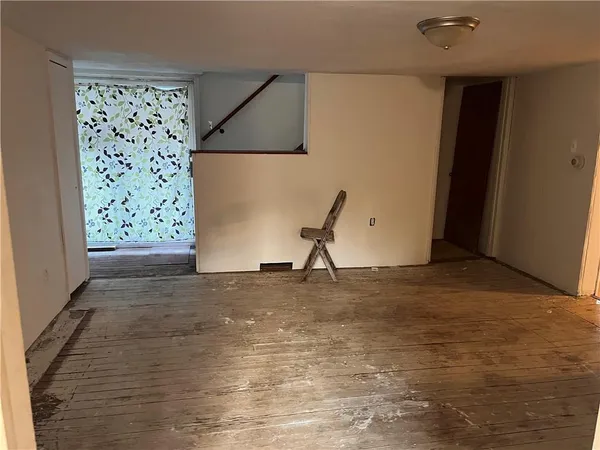 a view of a livingroom with wooden floor