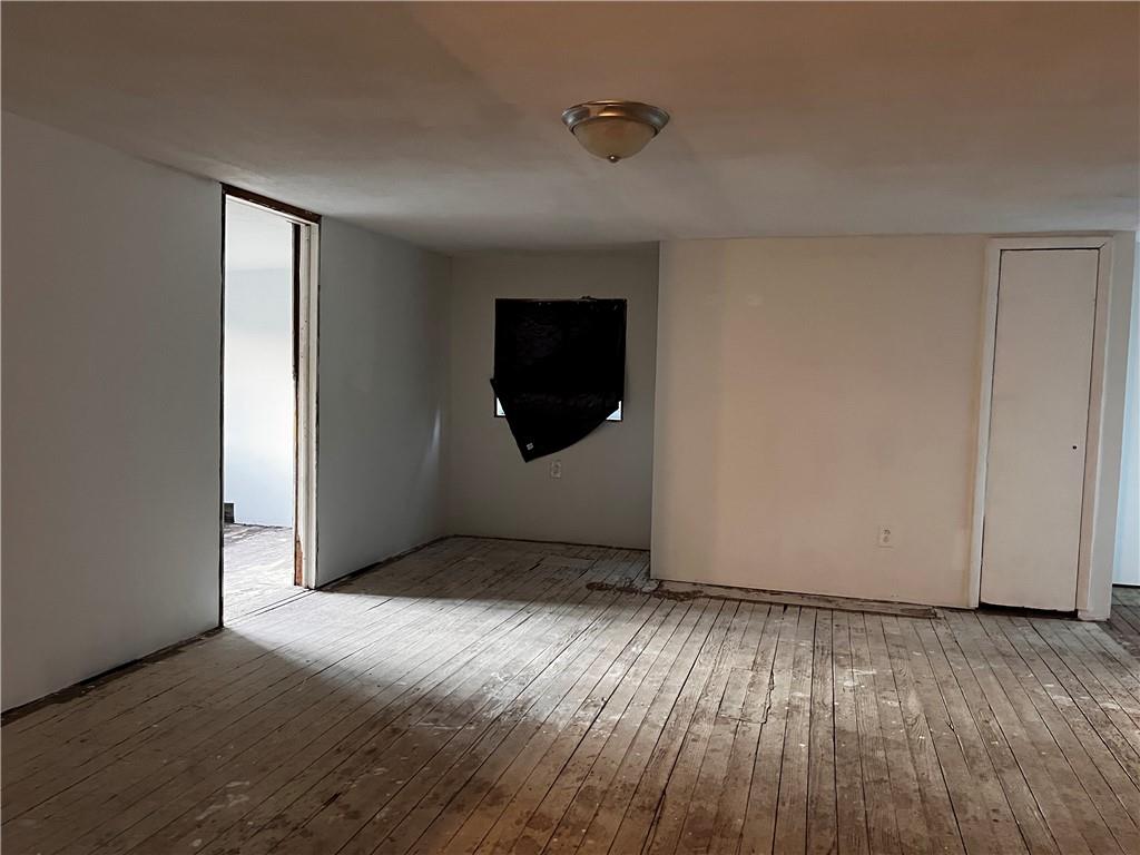 336 North Main Street Houston, PA 15342 - Photo 4 of 13 a view of an empty room with wooden floor and a window