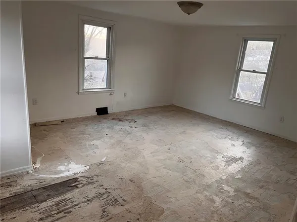 an empty room with windows