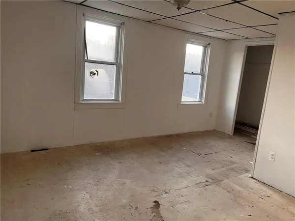 an empty room with windows