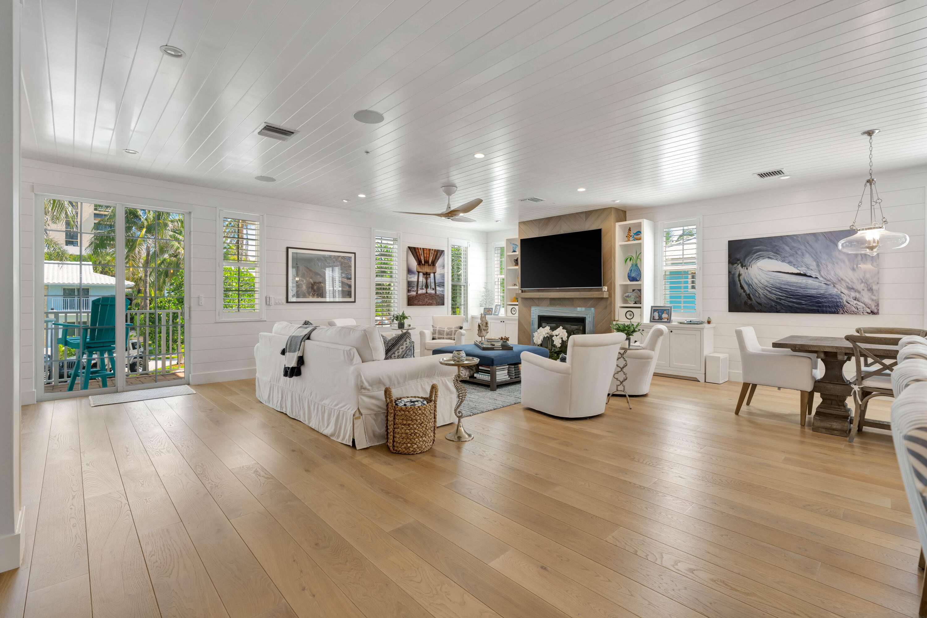 270 Mercury Road, Unit D Juno Beach, FL 33408 - Photo 12 of 107 a living room with fireplace furniture and a flat screen tv