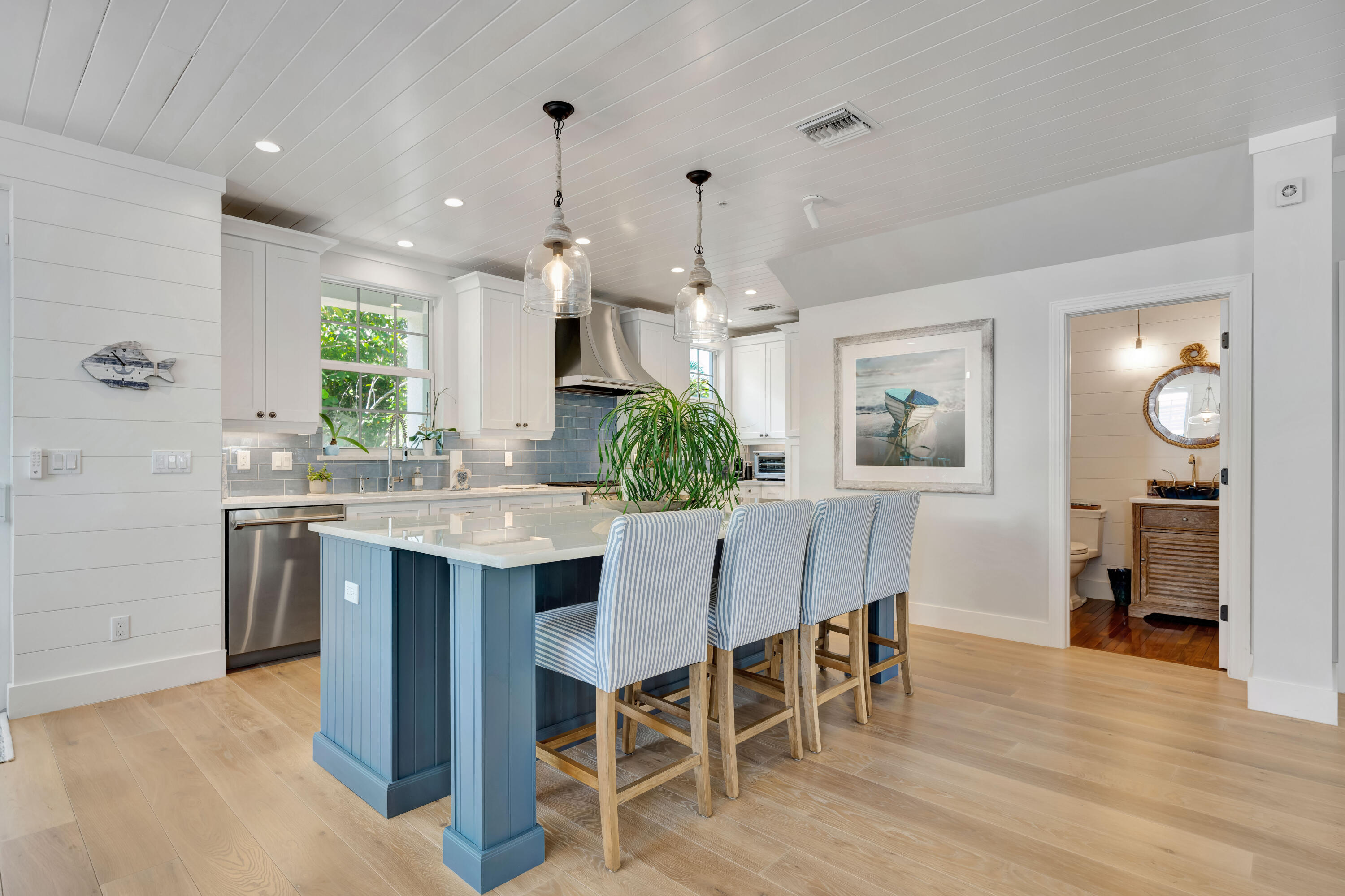 270 Mercury Road, Unit D Juno Beach, FL 33408 - Photo 14 of 107 a view of a dining room with furniture and wooden floor
