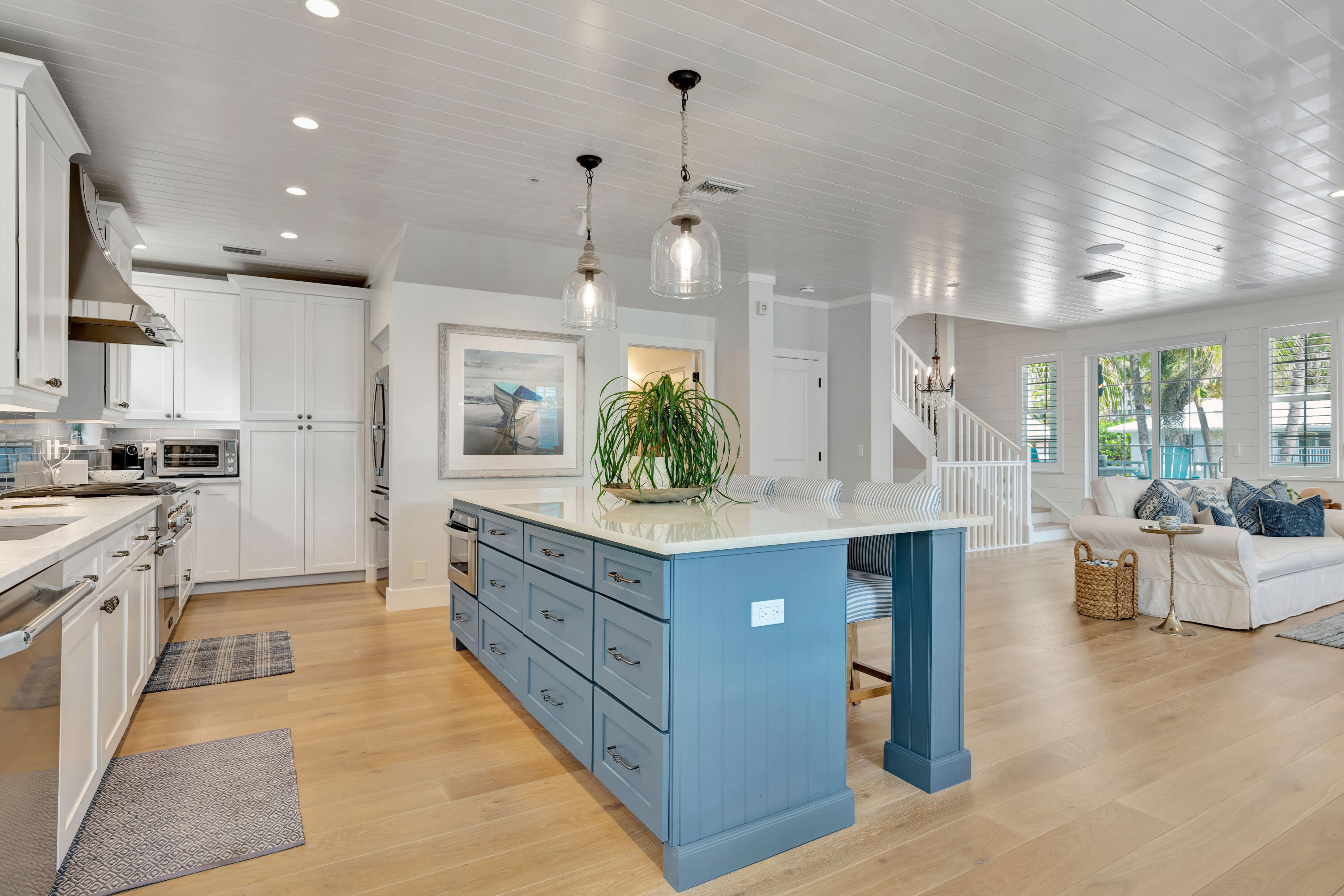 270 Mercury Road, Unit D Juno Beach, FL 33408 - Photo 15 of 107 a kitchen with granite countertop a stove and white cabinets