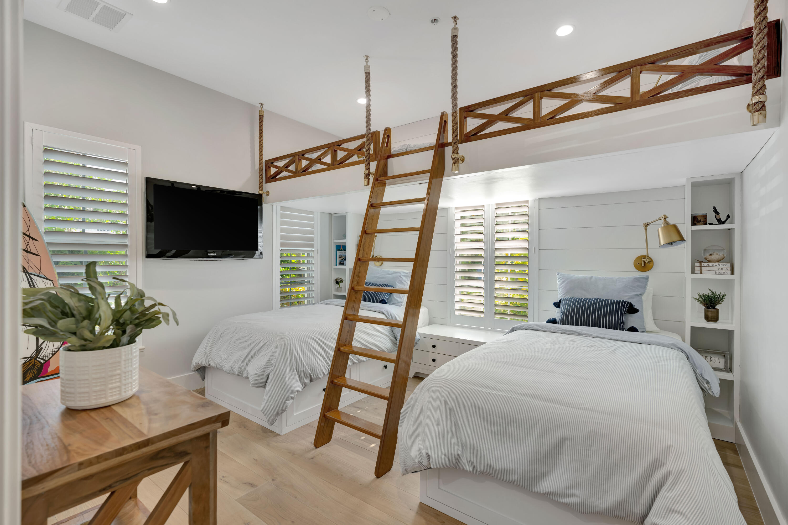 270 Mercury Road, Unit D Juno Beach, FL 33408 - Photo 23 of 107 a bedroom with a bed and a flat screen tv