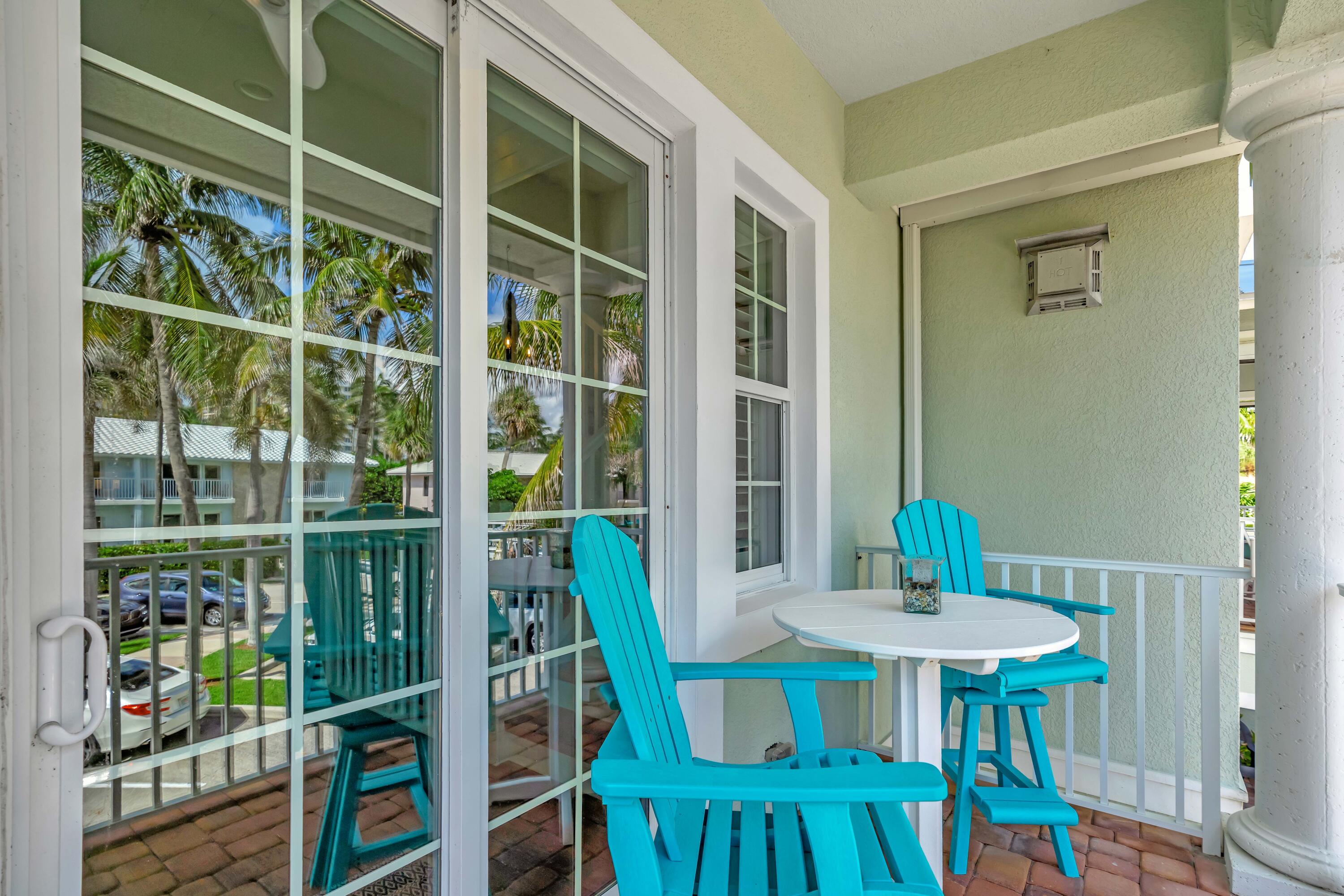 270 Mercury Road, Unit D Juno Beach, FL 33408 - Photo 31 of 107 a view of a dining room with furniture window and wooden floor