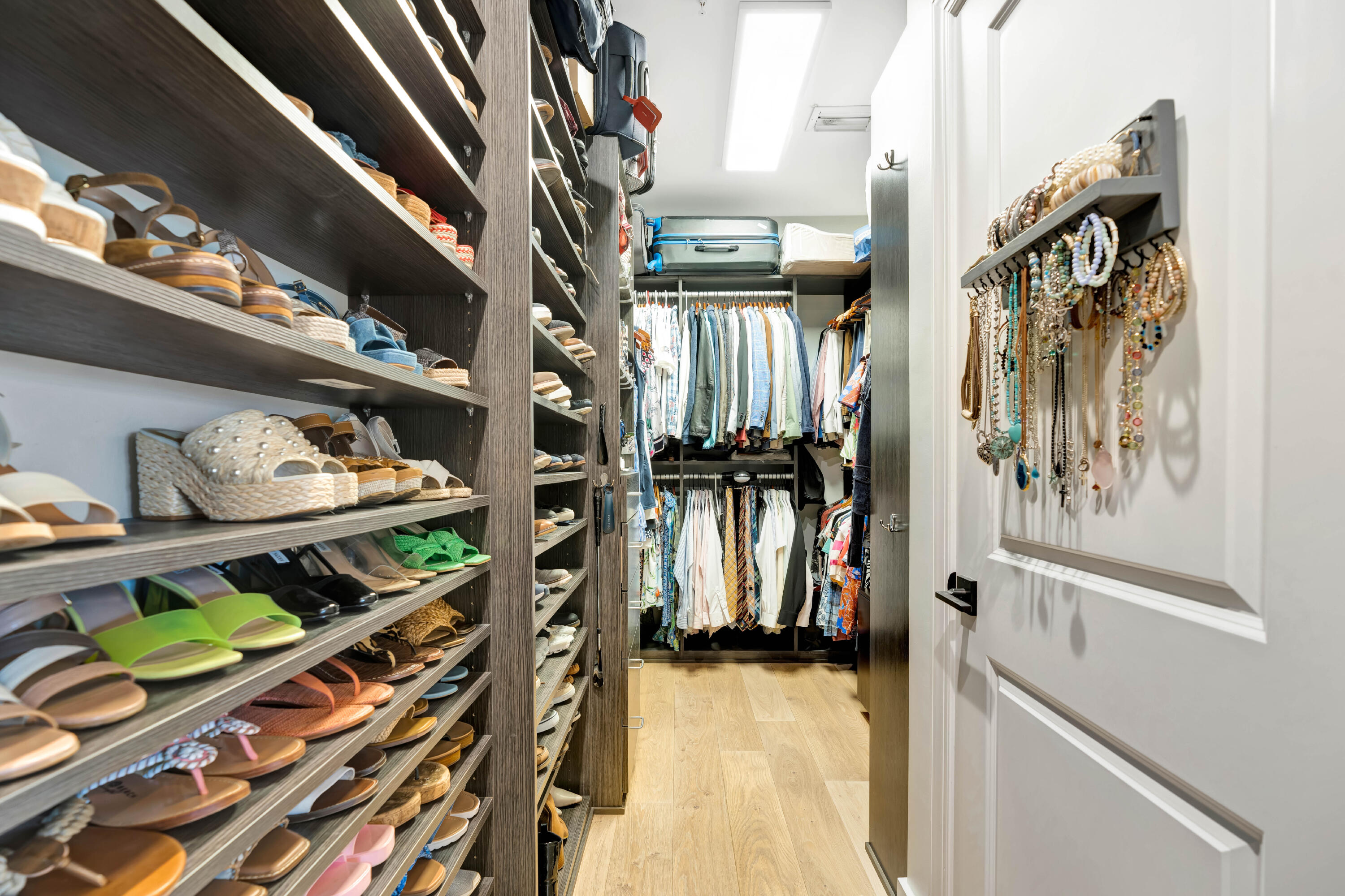 270 Mercury Road, Unit D Juno Beach, FL 33408 - Photo 58 of 107 a view of walk in closet with clothes and shoes
