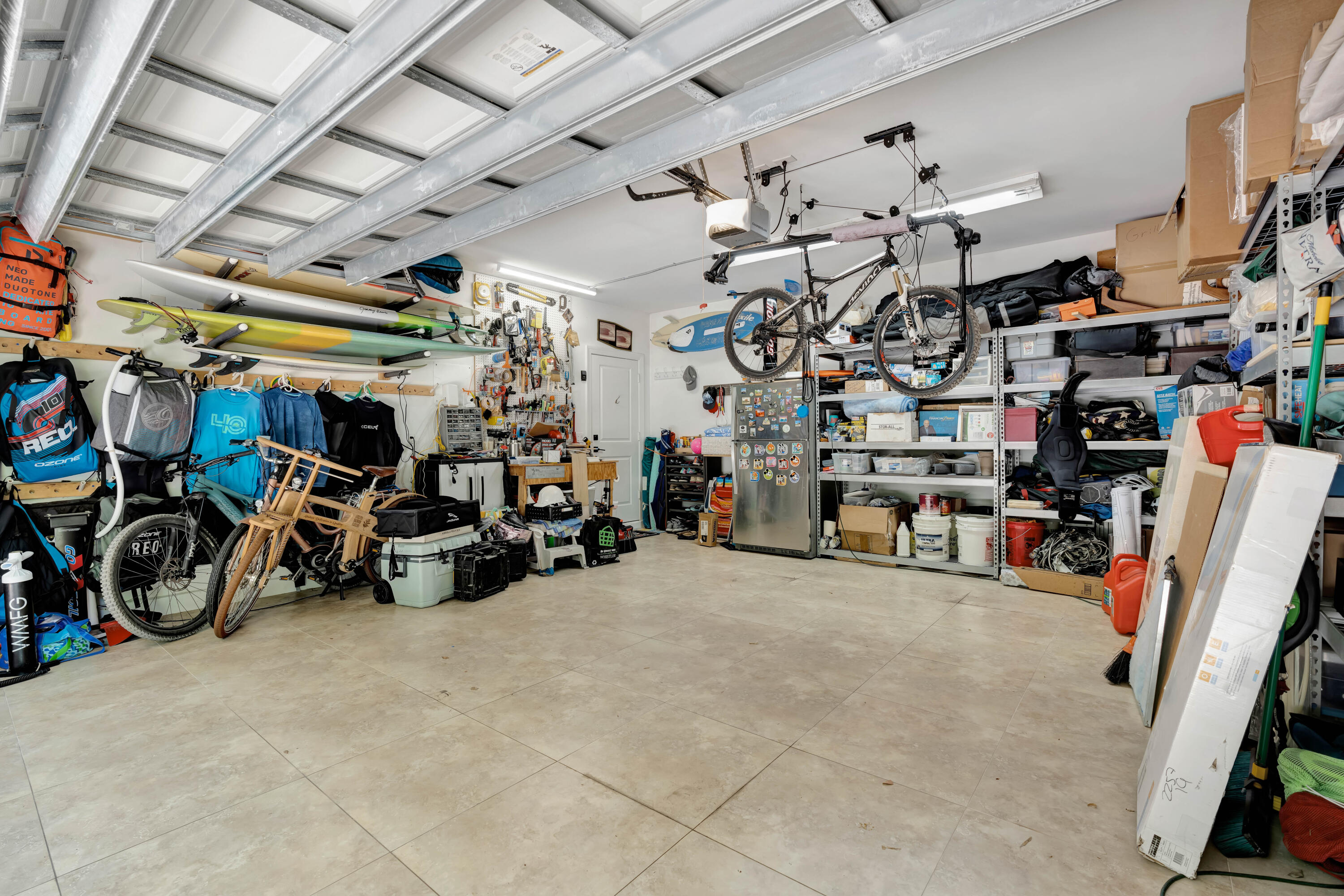 270 Mercury Road, Unit D Juno Beach, FL 33408 - Photo 78 of 107 a view of a storage room with a lot of stuff