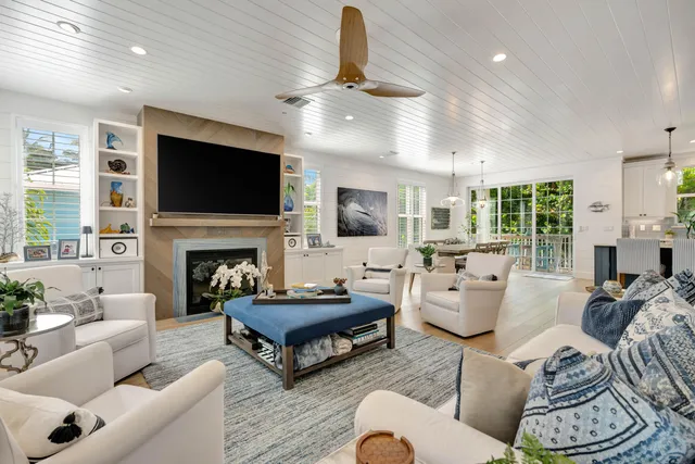 a kitchen with granite countertop a stove and white cabinets