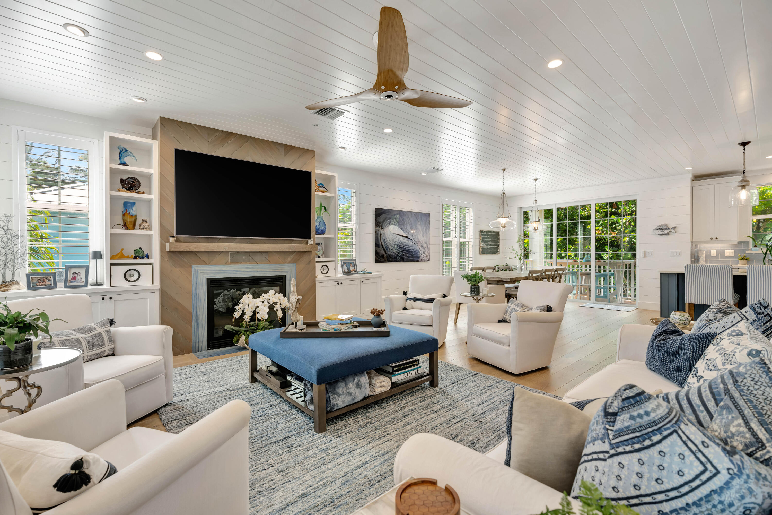 270 Mercury Road, Unit D Juno Beach, FL 33408 - Photo 8 of 107 a living room with furniture fireplace and a flat screen tv